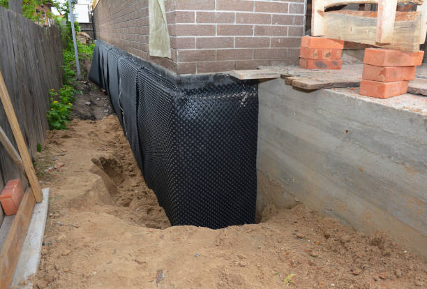 Happy homeowners after waterproofing job in Bonduel